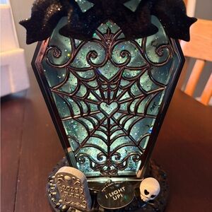 Bath and Body Works light up coffin water globe.